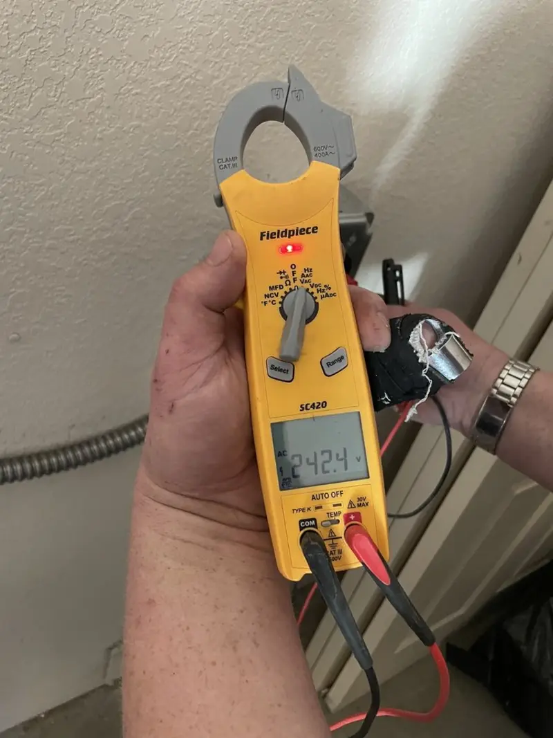 Voltage testing with clamp meter during Circuit Breaker Repair in Saco